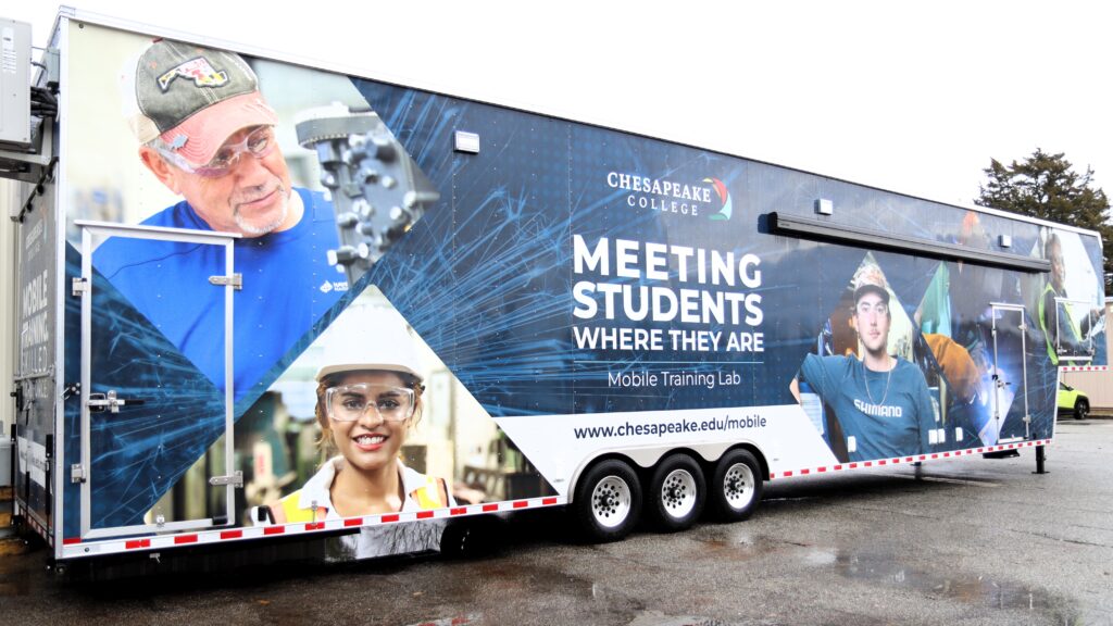 Welding trailer showing photos of students in skilled trades with text Meeting Students Where They Are Mobile Training Lab