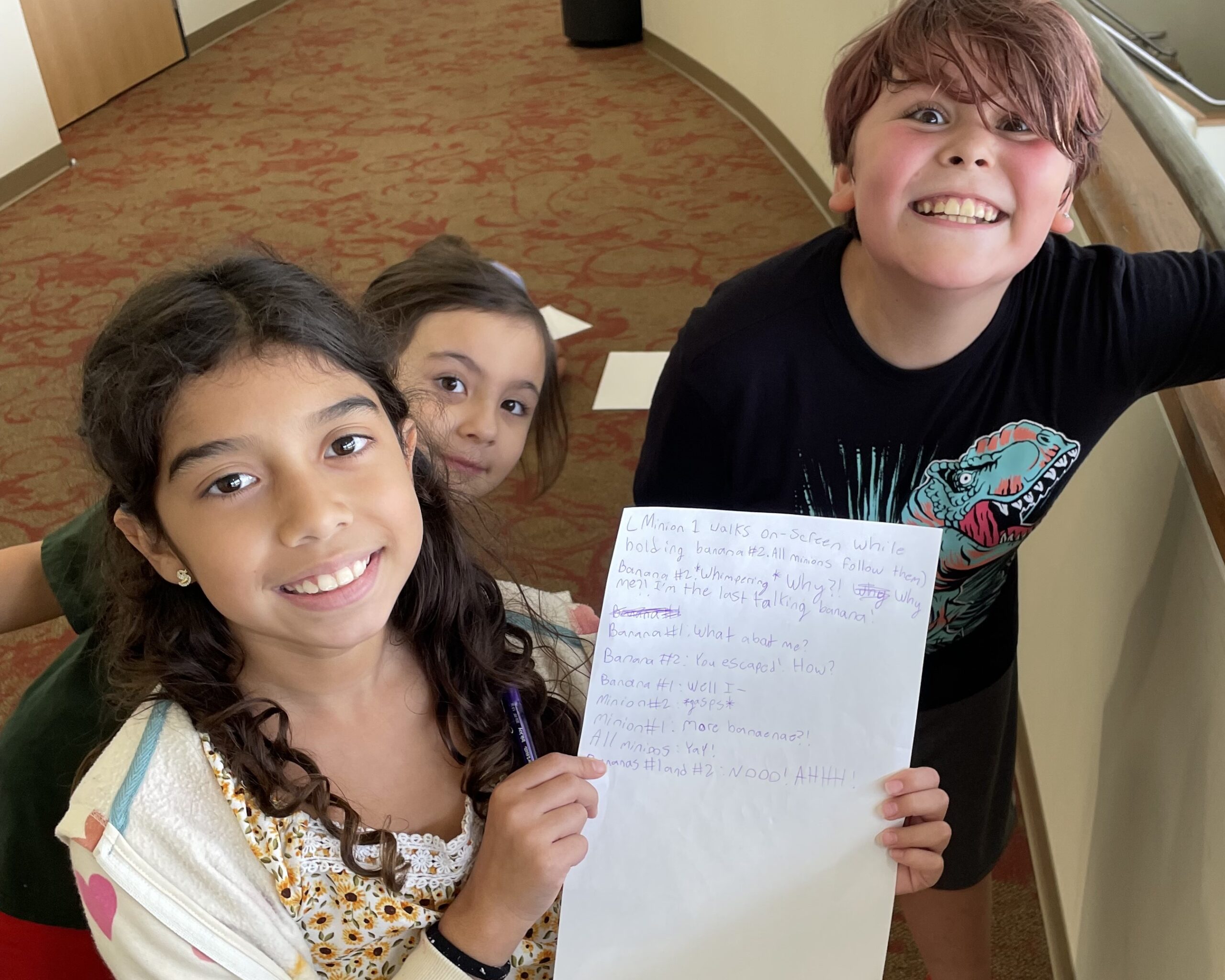 theater camp participants with their movie script for storytelling