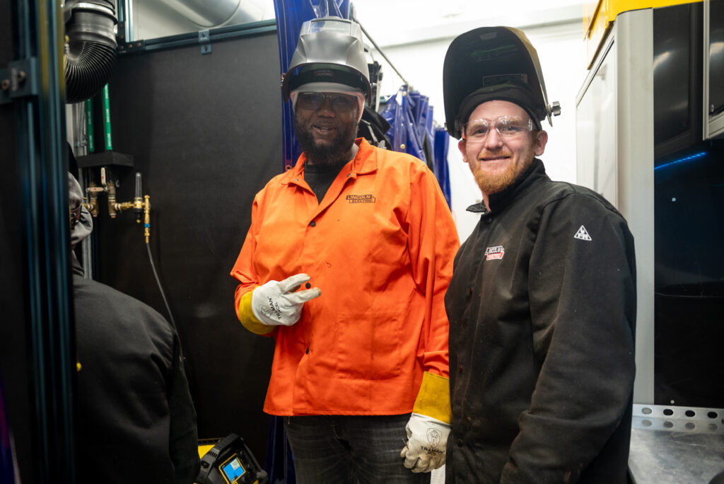 Two students who attended a Welding Info Session then took the class in the Mobile Welding Lab trailer at the Cambridge Center