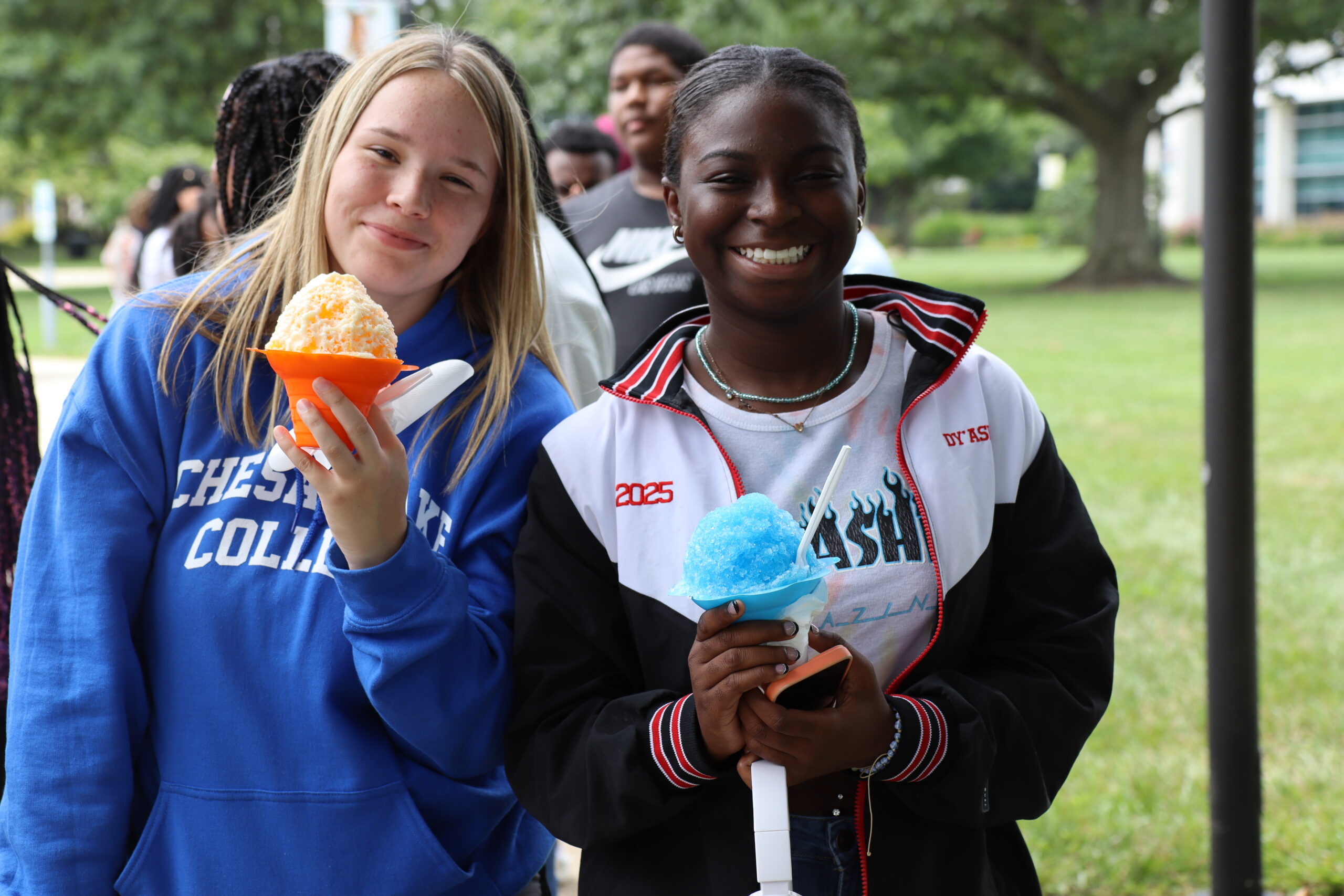 Two young ladies enjoy Kona Ice snow cones